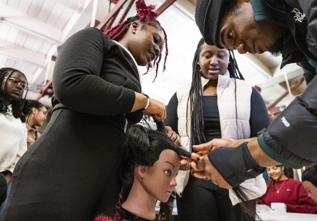 Learning African American hair care using a mannequin head