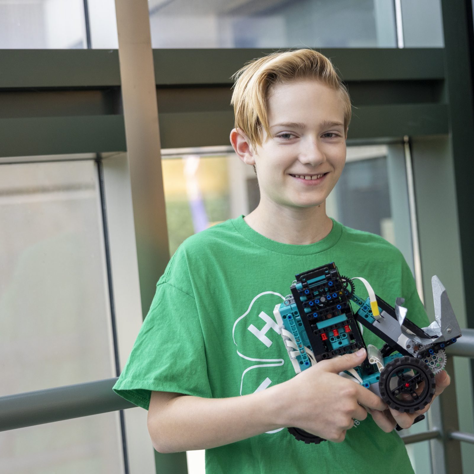 4-H member holding their robotics project