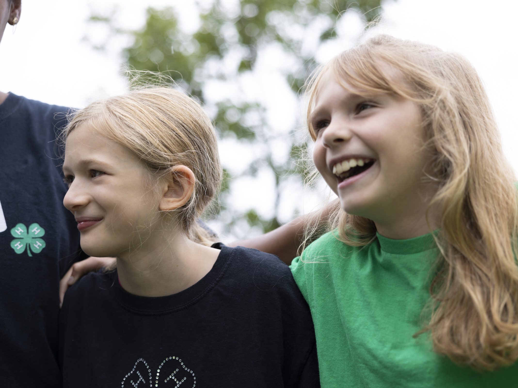Two young girls laughing.