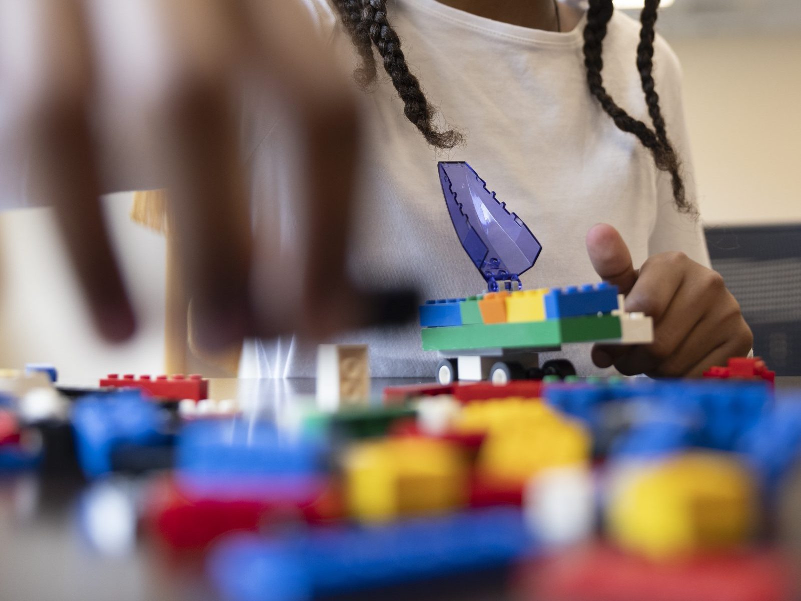 Kid playing with LEGOs 
