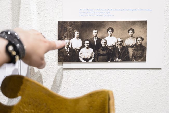 Finger pointing to a photo from many years ago.
