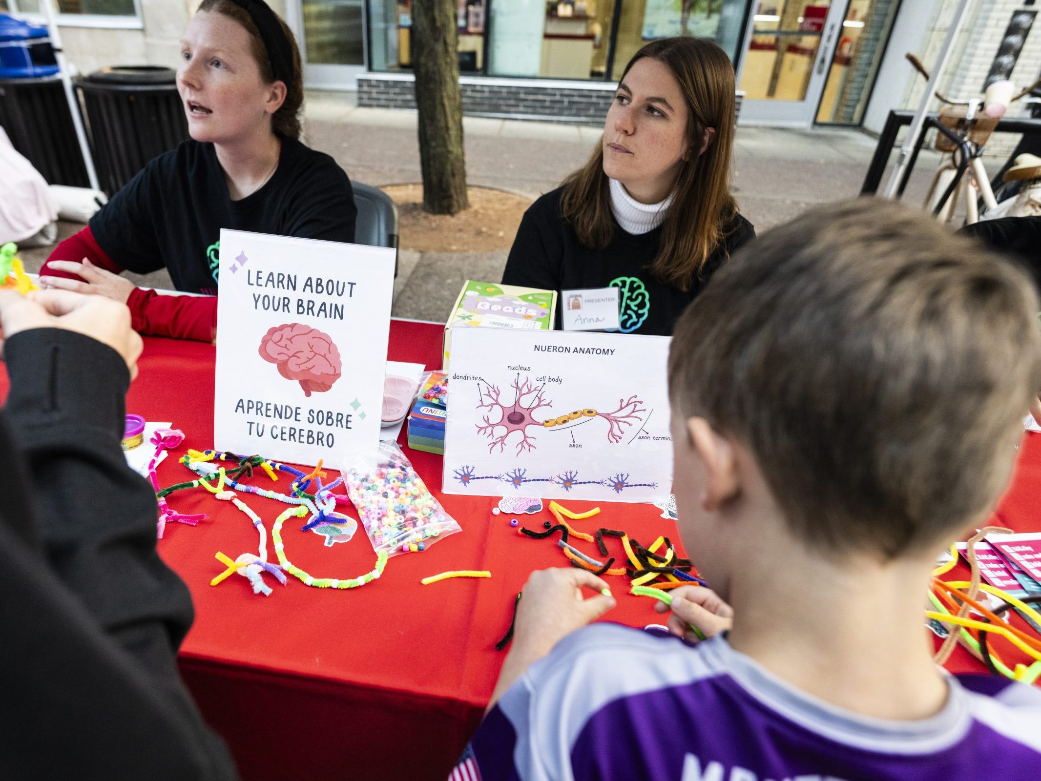 Kids at a booth learning about mental health.