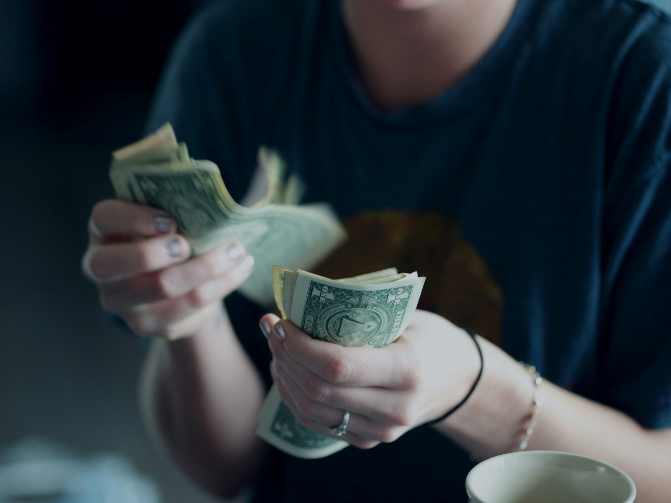 Person counting paper money